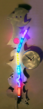 "Whimsy Clock III, featured in this virtual neon art gallery, displaying the neon sculpture and neon art installations, including modern and contemporary art work as well as a line of neon clocks and wall sconces